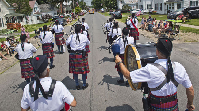 Marching bands, antique trucks highlight parades